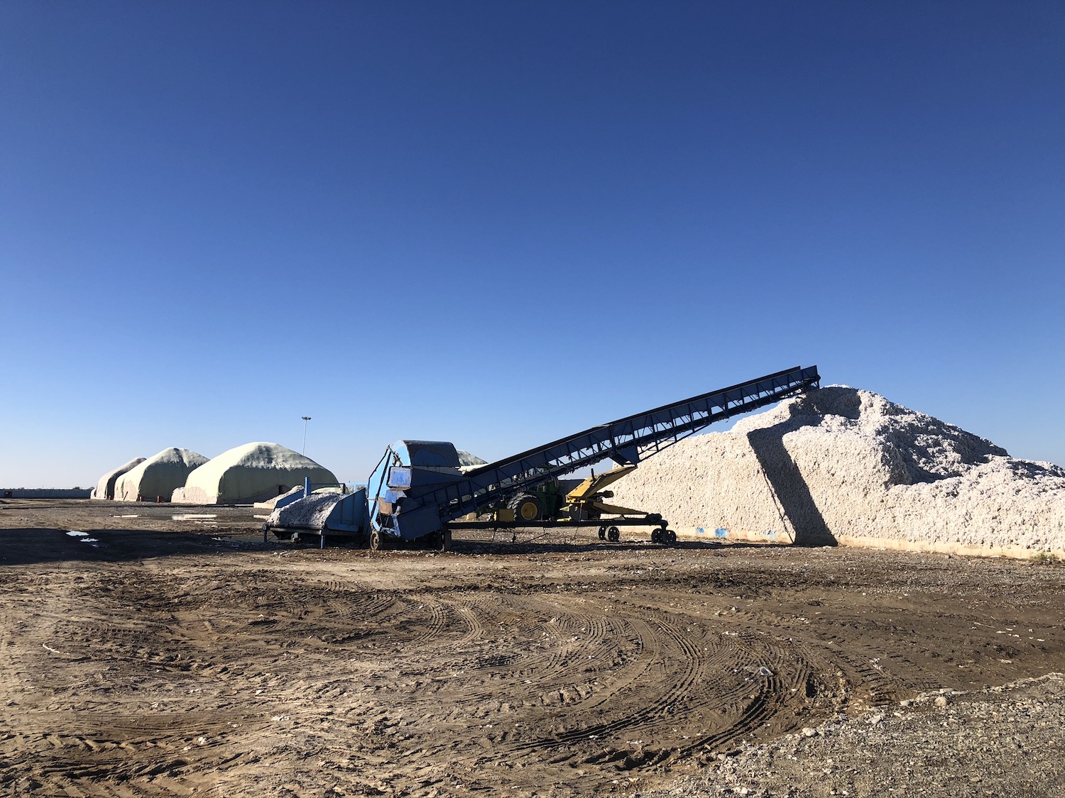 Cotton harvesting machinery in a field in Uzbekistan.